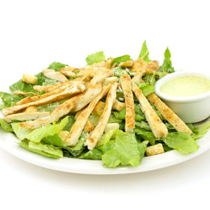Caesar salad with parmesan cheese, croutons and chicken