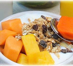 Fresh tropical fruit with yogurt and granola