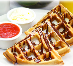 Belgian waffles with strawberries and cream