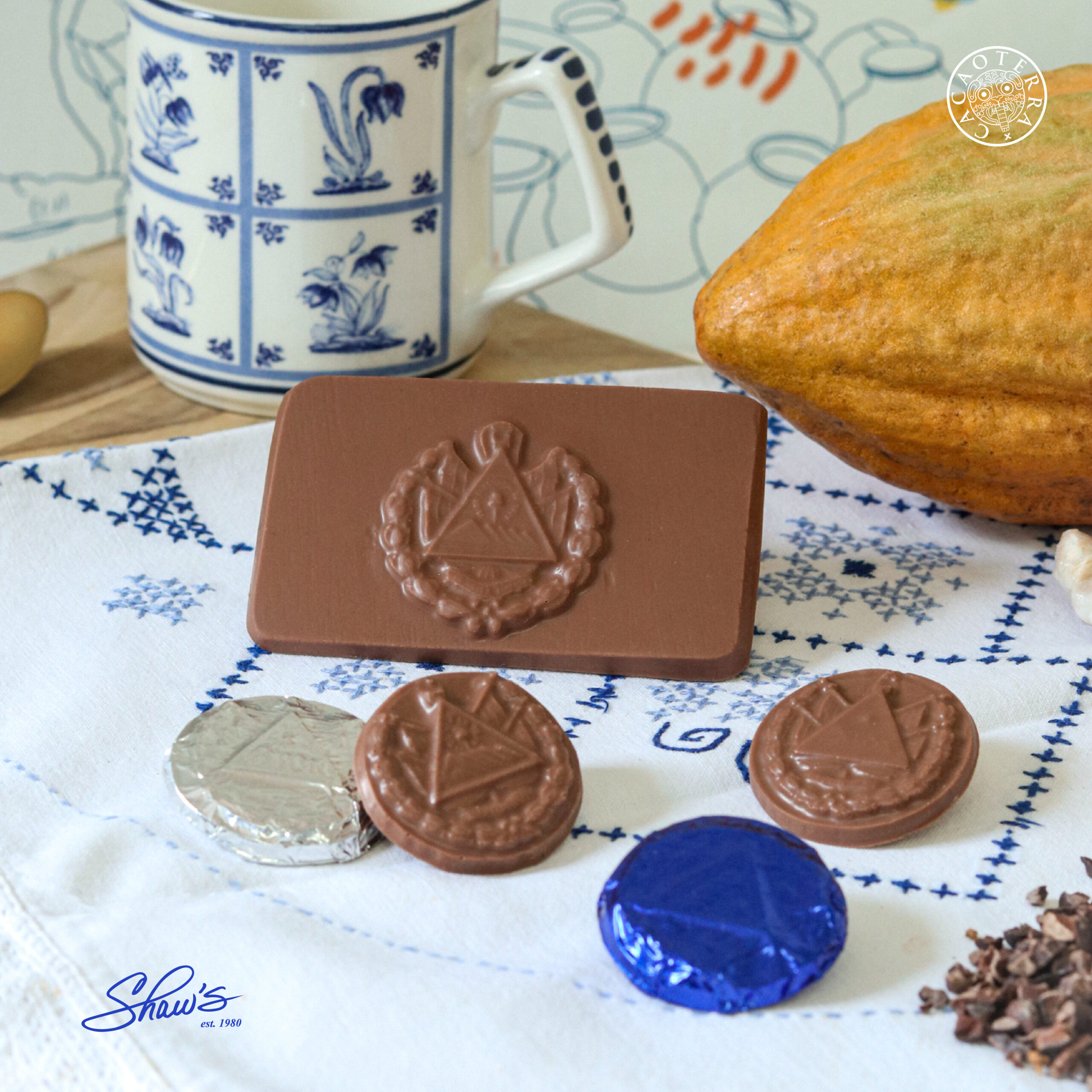 Linea Civica Shaws Escudo de ES en chocolate